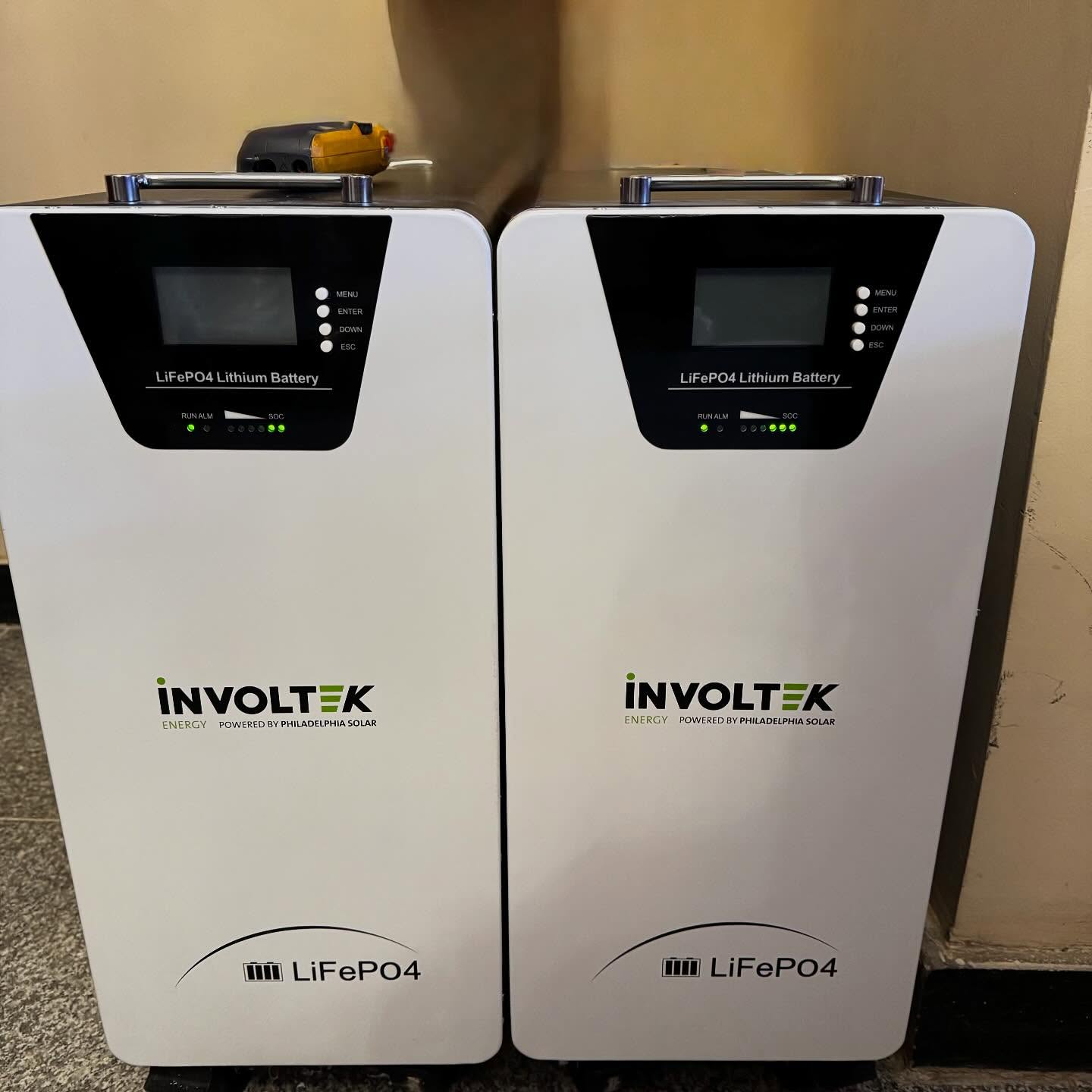Two INVOLTEK LiFePO4 lithium battery towers installed at the site