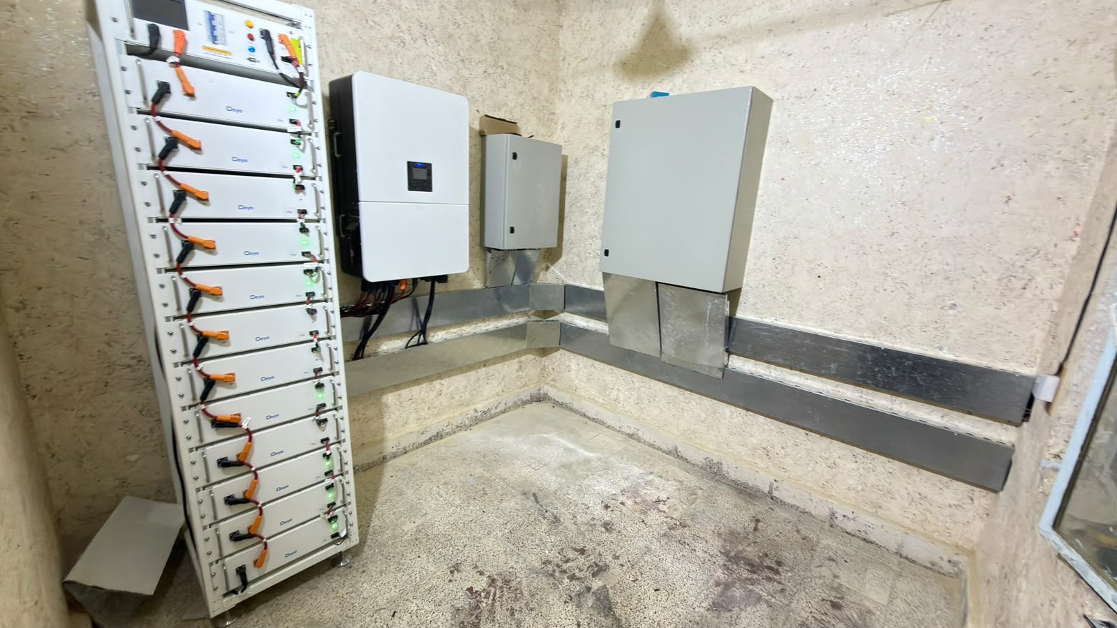 Deye battery energy storage racks and hybrid inverters inside the power room